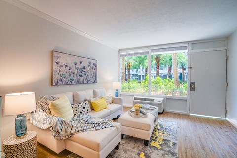 a living room with a couch and a large window